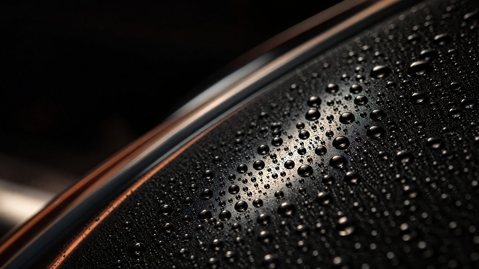 Water beading in tight domes on sealed dark paint